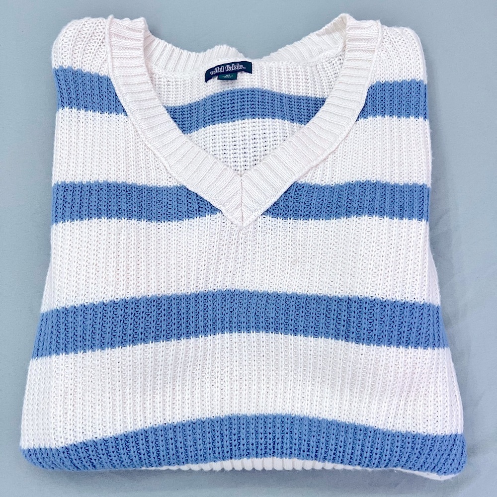Blue and white knitted sweater with a “V” neck line from wild fable. Size XS